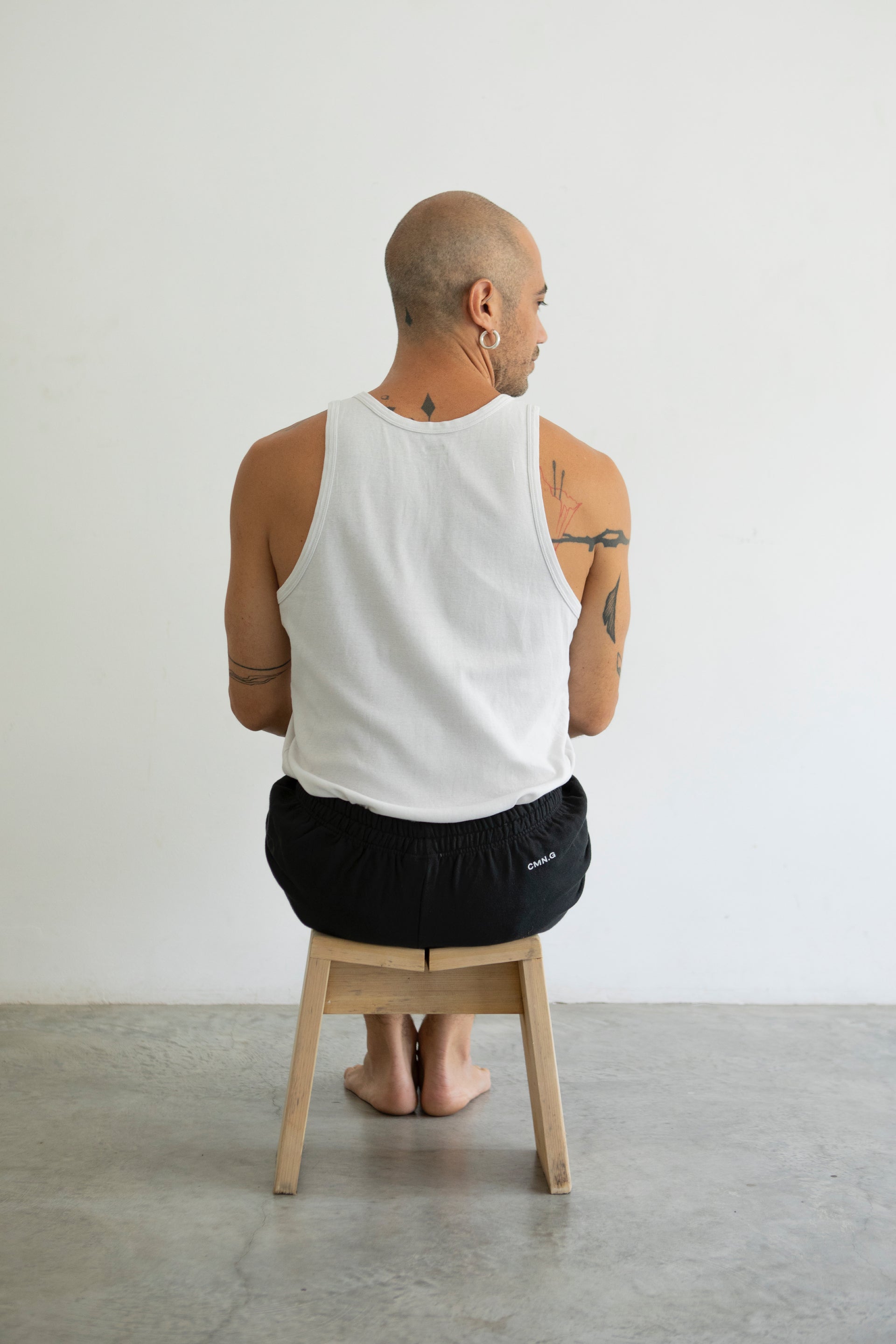 A man wearing yoga pants made of 100% organic cotton men yoga pants soft organic cotton Yoga pants for perfect movement practice yoga men yoga short faded black color yoga pants
